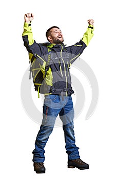 Happy hiker raising his hands up