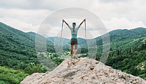 Happy hiker with trekking poles.