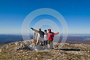 Happy hikers on mount summit