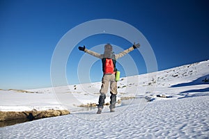 Happy hiking female on snow