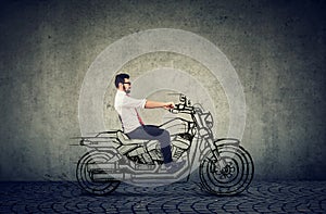 Happy hipster business man riding a motocycle