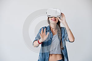 Happy hipster experiencing vr glasses