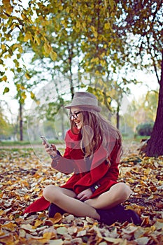 Happy hipster girl with cell phone