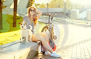 Happy Hipster Girl with her Pet in Summer Park