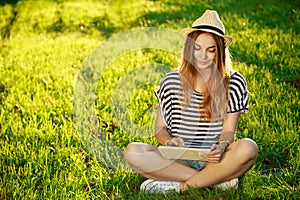 Happy Hipster Girl Using Tablet Outdoors