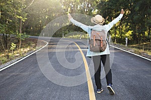 Happy hipster old women backpack traveling on the road relax time and holiday