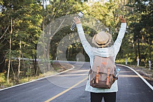 Happy hipster old women backpack traveling on the road relax time and holiday