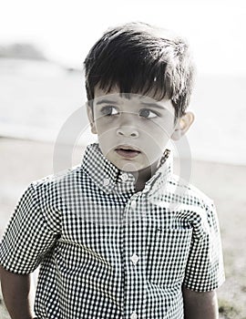 Happy hispanic boy with curious expression