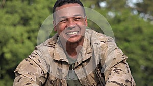 Happy Hispanic Male Soldier Talking Wearing Camo