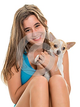 Happy hispanic teenage girl with her small dog
