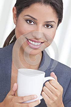 Happy Hispanic Woman Drinking Tea or Coffee