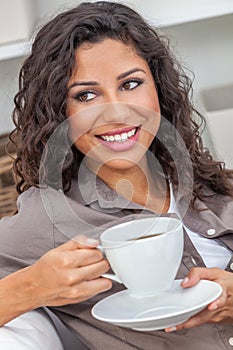 Happy Hispanic Woman Smiling Drinking Tea or Coffee at Home