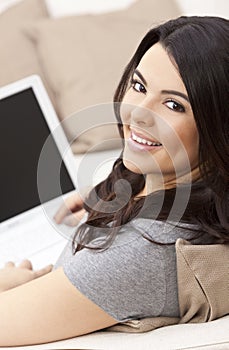 Happy Hispanic Woman Using Laptop Computer