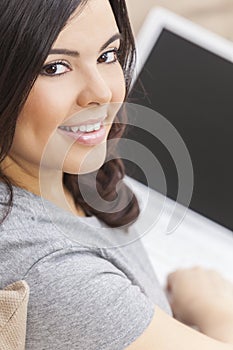 Happy Hispanic Woman Using Laptop Computer