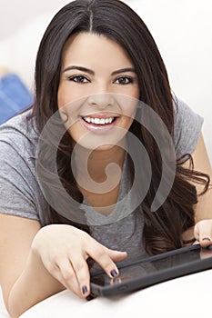 Happy Hispanic Woman Using Tablet Computer or iPad