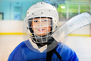 Happy hockey player preparing to go out on the ice photo