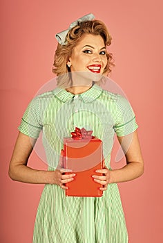 Happy holiday, celebration, vintage party. Retro woman with present box, pinup.