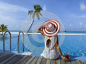 Happy a holiday in Summer blue trend with young woman in hat at happy freedom lifestyle
