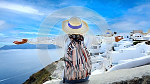 Happy a holiday in Summer with young woman in hat as a happy freedom lifestyle in Aegean sea mediterranean