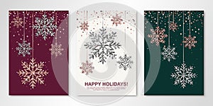 Happy Holidays banners set with rose gold and silver hanging snowflakes. Vector winter design templates for invitations, greeting