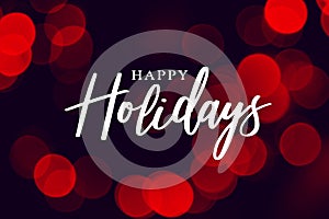 Happy Holidays Calligraphy with Red Duotone Bokeh Lights Background