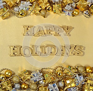 Happy Holidays golden text and Christmas decorations