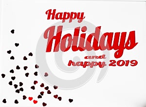 Happy Holidays and happy 2019 text with Holiday red christmas decorations