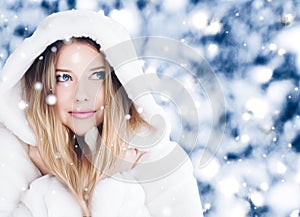 Happy holidays, lifestyle and winter fashion, beautiful woman wearing white fluffy fur coat, snowing snow in snowy