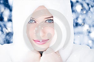 Happy holidays, lifestyle and winter fashion, beautiful woman wearing white fluffy fur coat, snowing snow in snowy