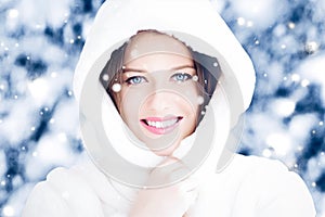 Happy holidays, lifestyle and winter fashion, beautiful woman wearing white fluffy fur coat, snowing snow in snowy