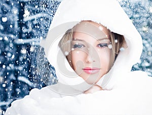 Happy holidays, lifestyle and winter fashion, beautiful woman wearing white fluffy fur coat, snowing snow in snowy