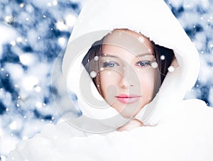 Happy holidays, lifestyle and winter fashion, beautiful woman wearing white fluffy fur coat, snowing snow in snowy