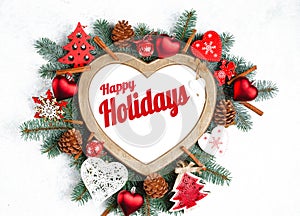 Happy Holidays Text with Holiday Evergreen Branches, frame in the shape of a heart