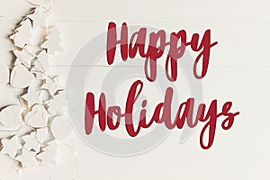 Happy holidays text, seasonal greetings card sign. minimalistic