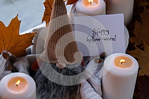HAPPY HOLLOWEEN text greeting card concept Celebrating halloween autumn holidays at cozy home on the windowsill Hygge