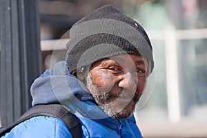 Happy homeless african american man