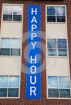 Happy Hour Sign on Building