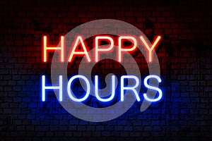 Happy hours. Neon sign with luminous letters of red and blue on black brick wall.