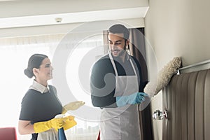 happy housekeepers looking at each other