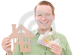 Happy houseowner with money