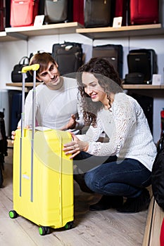 Happy husband and wife selecting handy trunk