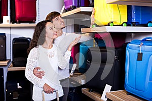 Happy husband and wife selecting handy trunk