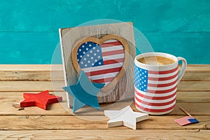 Happy Independence Day, 4th of July celebration concept with coffee cup and american flag on wooden table