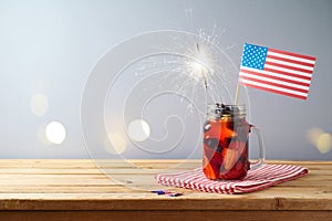 Happy Independence Day, 4th of July celebration concept with summer fruit drink and USA flag on wooden table