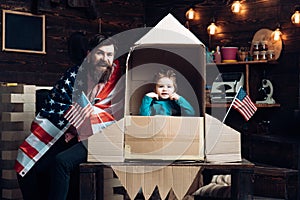 Happy independence day of the usa. independence day of usa with happy family hold american flag at paper rocket.