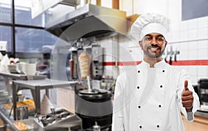 Happy indian chef showing thumbs up at kebab shop