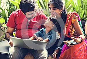 A happy Indian family spending time together photo
