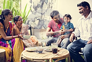 A happy Indian family spending time together at home photo