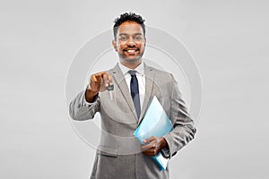 Happy indian man showing car key