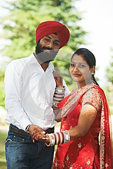 Happy indian young adult married couple